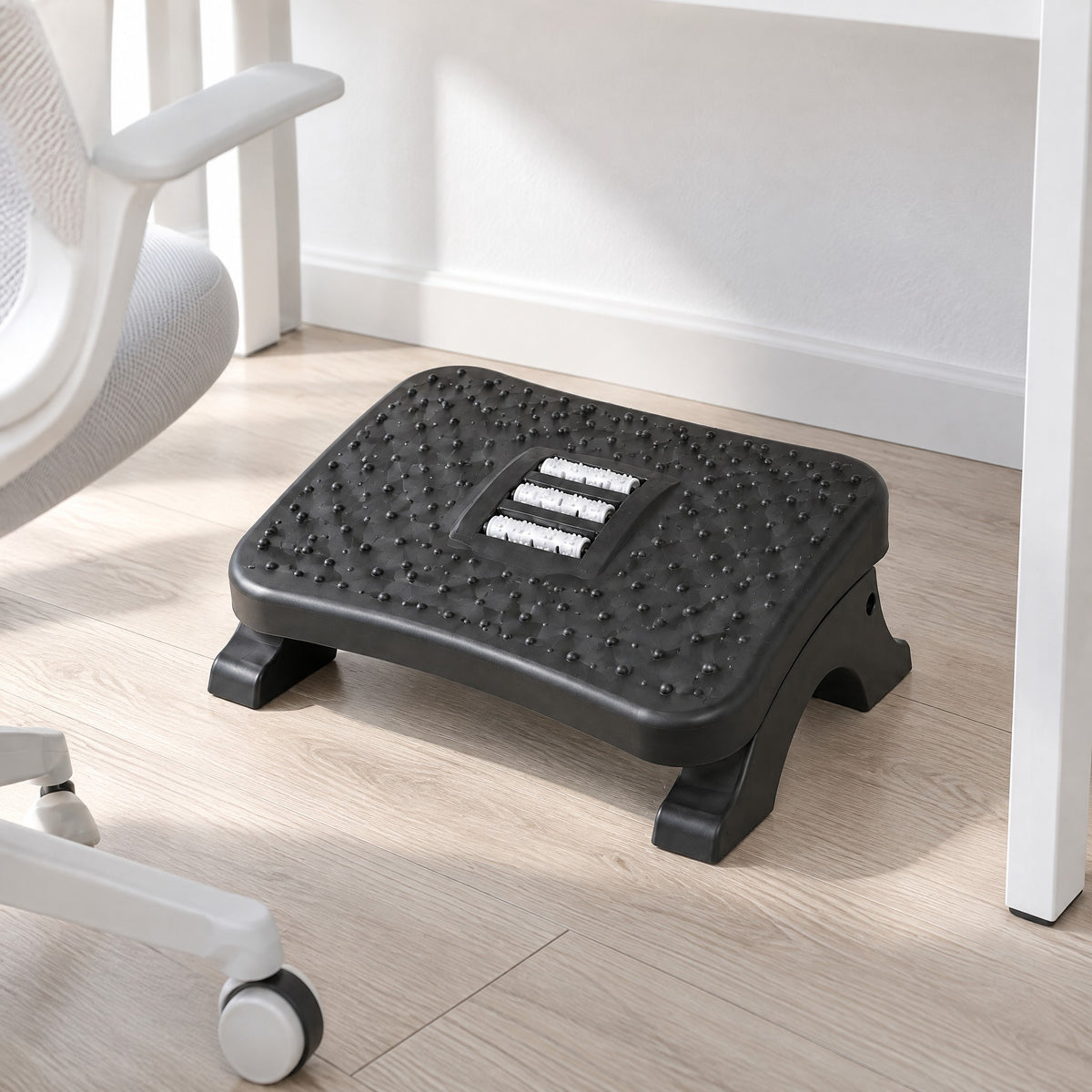 Ease massage footrest under a white desk