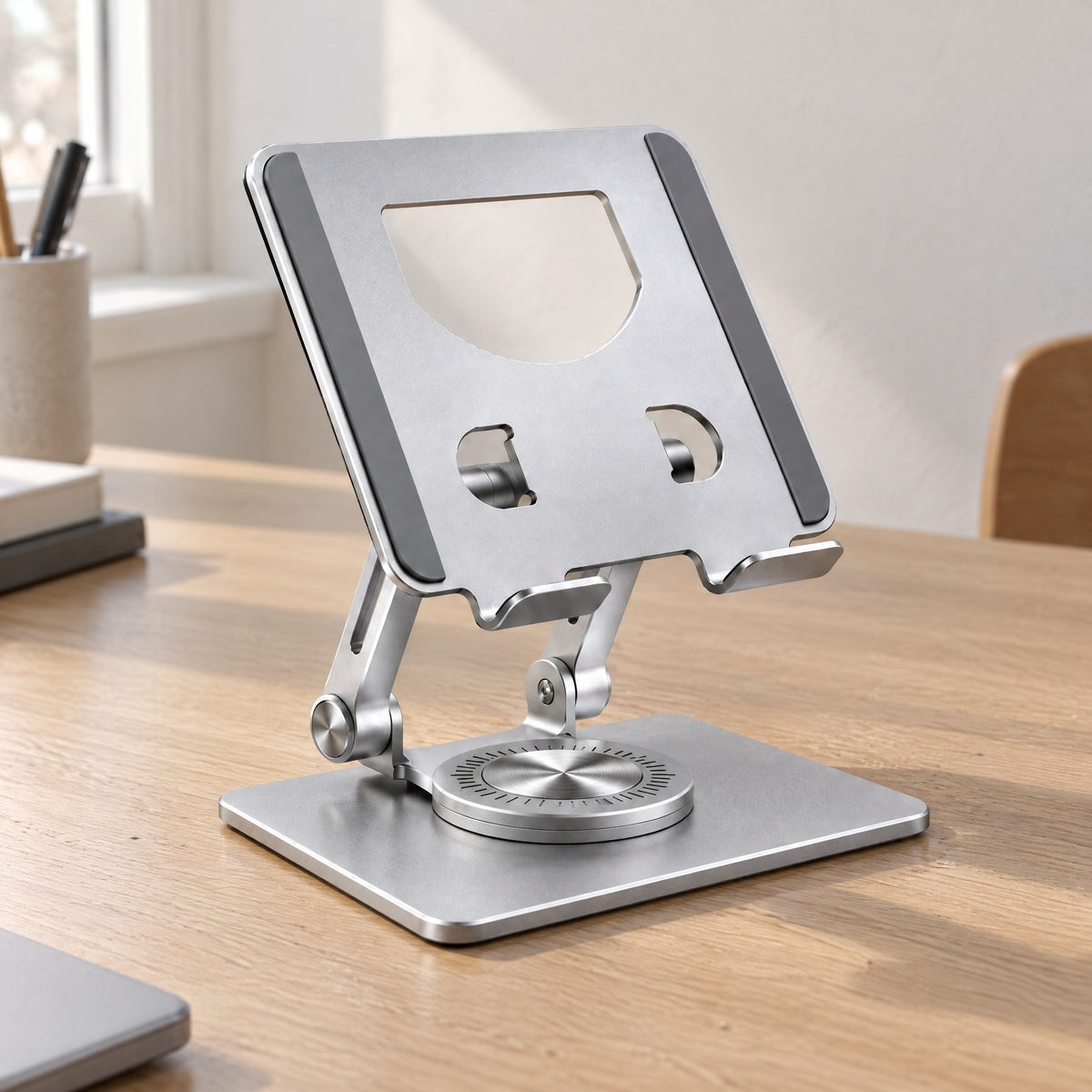 Pivot tablet stand in silver showing the rotating base and two hinges