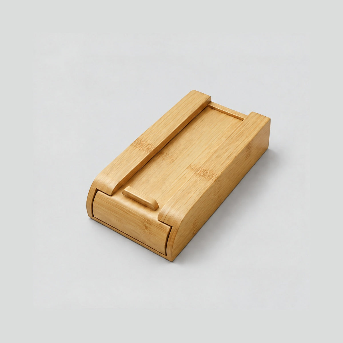 Small bamboo Glide drawer turned over to show its pull bar and curved front