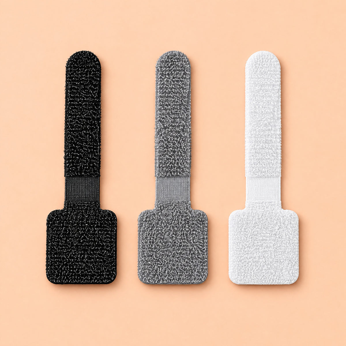 Velor cable ties in black, grey and white, side by side