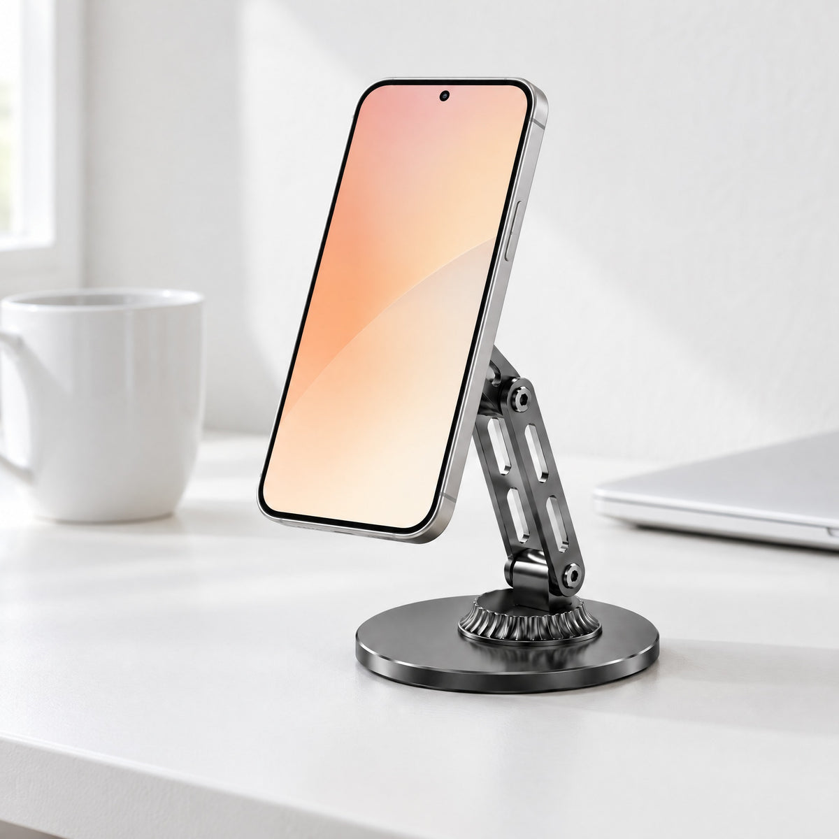 Black Crane magnetic phone stand holding a phone upright on a white desk beside a mug