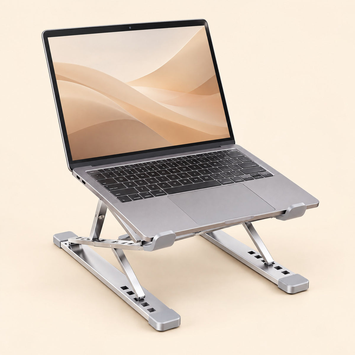 Silver folding laptop stand holding a laptop