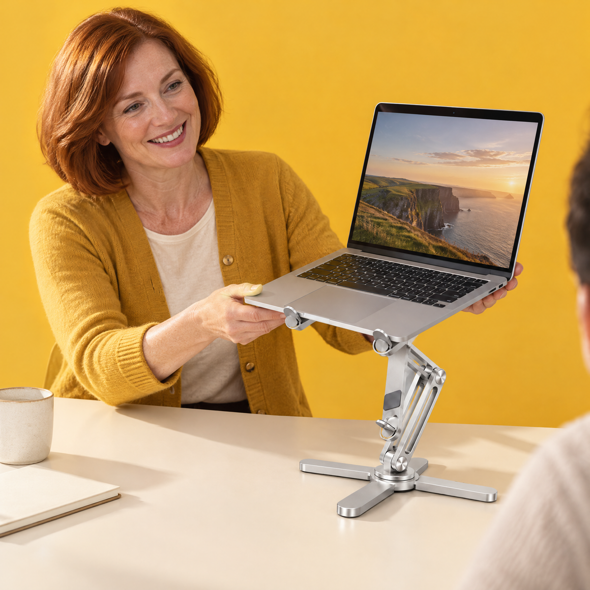 Rotating aluminium laptop stand in use