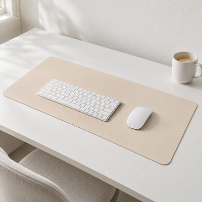 Flow desk mat in eggshell with a white keyboard and mouse on a white desk