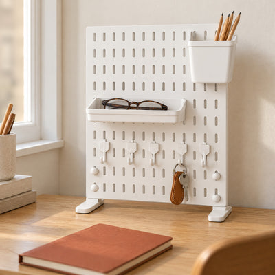 White Trellis desk pegboard with reading glasses in the tray and pencils in the bin