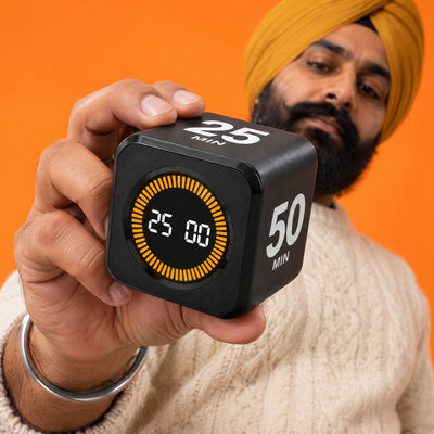 Man turning the black Cube flip timer over towards the camera