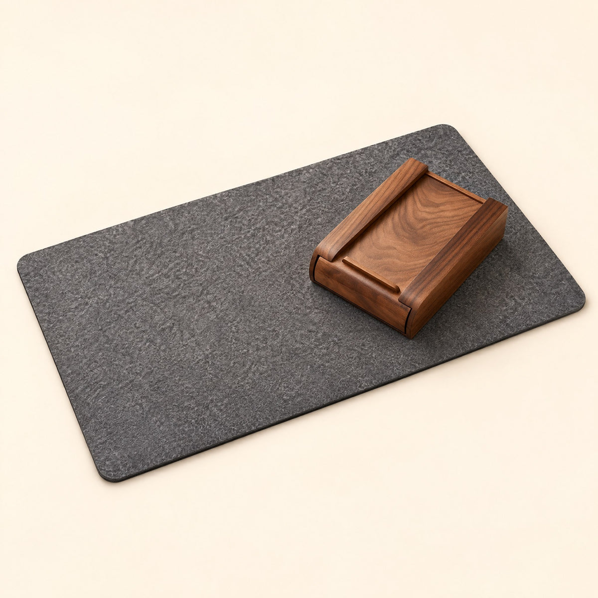 Grey felt desk mat with a walnut drawer box