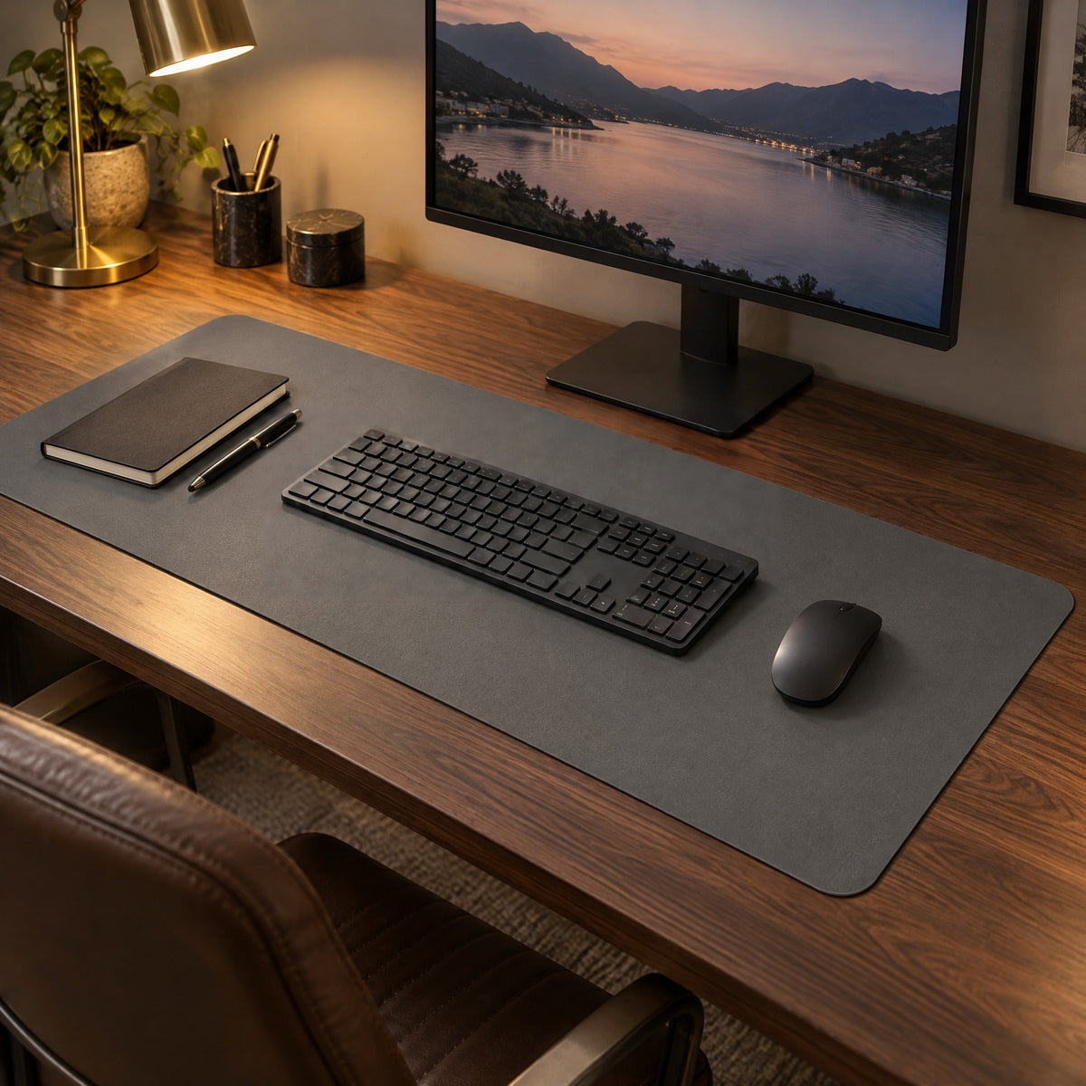 Flow desk mat in dark grey on a walnut desk